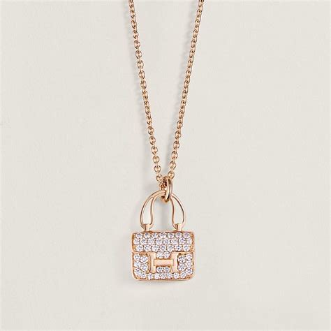 hermes 66139181463116|Amulettes Constance pendant .